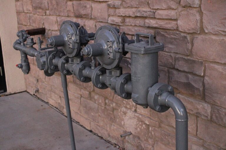 Plumbing pipes running along a wall
