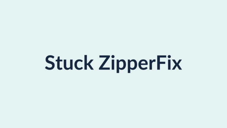 Using tweezers to free a stuck zipper jammed with fabric